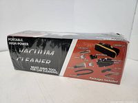 Box front showing vacuum cleaner and accessories illustrations with text 'Portable High-Power Vacuum Cleaner Must-Have Tool for Car Cleaning'