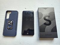 Protective case, smartphone and original box laid out