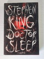 Front cover of the Stephen King Doctor Sleep hardcover book showing stylized smoke title.