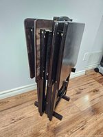 Five-piece set folded and stacked together showing profile with folding legs and stand base