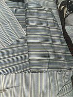 Close-up of striped fabric roll showing pattern and texture