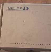 Closed cardboard box labeled Mini MX Home Media Entertainment Center