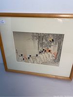 Front view of framed Japanese print showing the procession of priests and surrounding wooded scene