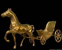 Close-up side angle showing detailed horse and carriage design