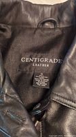 Label inside leather jacket showing 'Centigrade Leather', size 1X, material details, and care instructions.