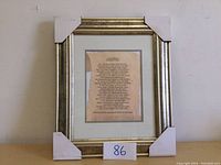 Front view of picture frame with silver molding, white mat board, and protective corner covers.