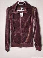 Full front view of brown velvet woman's blazer with hood and zipper, size M.