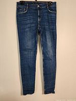 Front view of blue Zara skinny denim pants showing full length and fit.