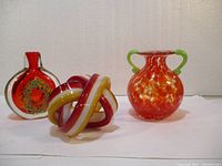 Full view of all three art glass pieces together showing colors and designs