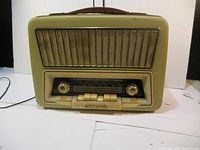 Front view of vintage Akkord radio showing speaker grille, tuning knobs and control buttons