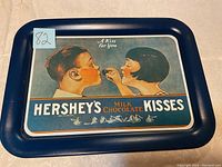 Full view of Hershey's Kisses tin with artwork and branding visible.