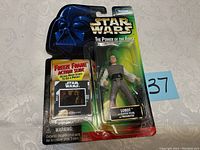 Front of original blister card featuring a Star Wars The Power of The Force Lobot action figure and Freeze Frame Action Slide.