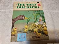 Photo of the vintage The Ugly Duckling storybook front cover showing the illustrated characters and title.