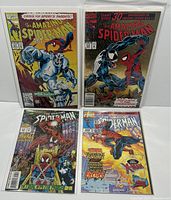 Four Marvel The Amazing Spider-Man comics displayed upright and flat, bagged and boarded, showing vibrant covers for issues 371, 375, 403, and 425.