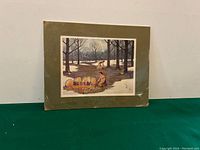 Full view of reproduction painting showing framed mat and plastic cover against white background.