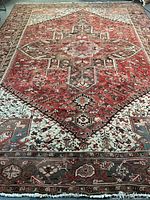 Full view of carpet showing central medallion and field pattern