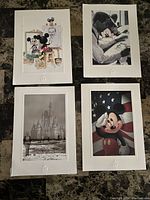 Four Disney-themed postcards with white borders showing Mickey Mouse and Cinderella Castle.