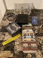 Photo showing the full assortment of items from the lot arranged on marble surface for scale and detail.