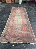 Full-length view of runner rug on wood floor showing overall pattern and colors