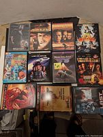 Photo showing all 11 DVDs with cover art visible.