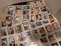 Full spread of 73 Superman collector cards laid out showing full set.