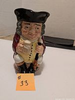 Front view of the Jolly Toby Royal Doulton mug showing detailed painted features and character design.