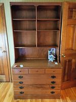 Front view of the Ethan Allen heirloom bookcase dresser showing upper shelves and lower drawers, medium brown wood finish