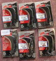 Front view of 6 packages of TTSK flooring knives with 10 blades in each pack. Three packs labeled Long Point, three labeled Short Point.