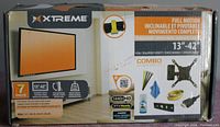 Closed box of Xtreme full motion inclinable and pivotable monitor/TV mount for 13 to 42 inch screens showing product features and packaging.