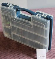 Closed plastic storage container with clear segmented lid and blue base, showing handle and latch closures.