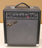 Front view of Traynor Bass Mate 10 amplifier showing control panel and top handle