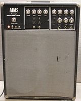 Front view showing control panel, speaker grille, master volume and channel EQ controls, toggles and input jacks.