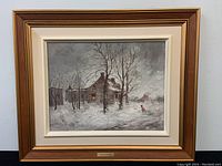 Framed oil painting with rustic winter scene, showing entire artwork and frame.