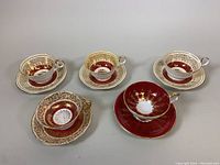 Five porcelain teacup and saucer sets including one Paragon and four Aynsley sets, showing overall condition and designs.
