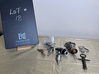 Photo of eight assorted bottle stoppers and two metal bottle openers on fabric surface