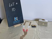 Photo shows all three items: Monet earrings, ombre necklace, trinket box on beige cloth.