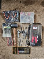 Full lot showing rubber mallet, 3 jaw puller set, precision screwdrivers, soldering kit, various pliers, and hardware organizer box.