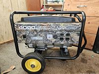 Front control panel showing wattage ratings, Champion logo, four 120V outlets and one twist-lock outlet