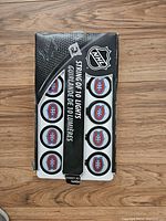 Top view of box showing 10 hockey puck shaped lights with Montreal Canadiens logos inside the packaging