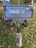 Front view showing ball coupler hitch and front panel with Member sticker