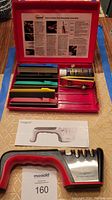 Full overview of the Gatco knife sharpening kit with sharpening stones, accessories, detailed instructions, and Longzon sharpener with instruction manual.