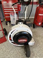 Front view of blower housing showing logo on impeller cover