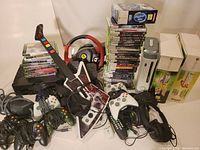 Overview of all items including consoles, controllers, wheel, headsets, guitars, pad and stacked games