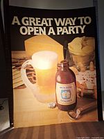 Front view of illuminated vinyl advertising insert showing beer mug, Molson Golden bottle, text and snack background.