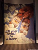 Full view of the translucent vinyl insert showing the two bottles of Labatt's Lite beer in hand surrounded by ice cubes and the slogan.