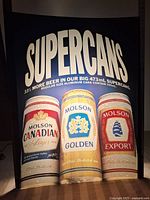 Photo of full advertising insert showing the three Molson beer cans and the SUPERCANS heading