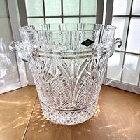 Full view of the Shannon Crystal clear heavy crystal champagne bucket with ornate cut patterns and curved handles.