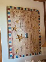 Image of rectangular starfish theme wall art with text and colorful border