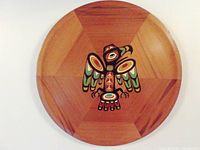 Top view of the round Western Red cedar tray showing the entire eagle design and wood grain.