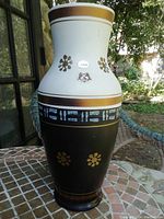 Full view of the 14 inch tall Hohr Germany ceramic vase showing white and brown body with gold flower motifs and geometric patterns near midsection.